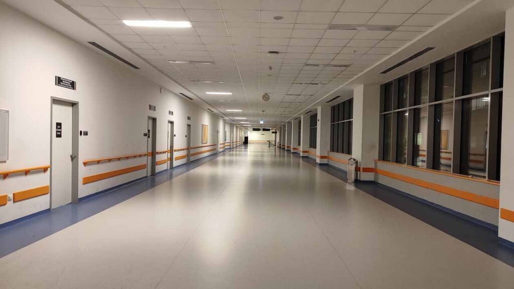 Commercial vinyl flooring in a hospital corridor, showing a durable and easy-maintenance floor for healthcare environments.